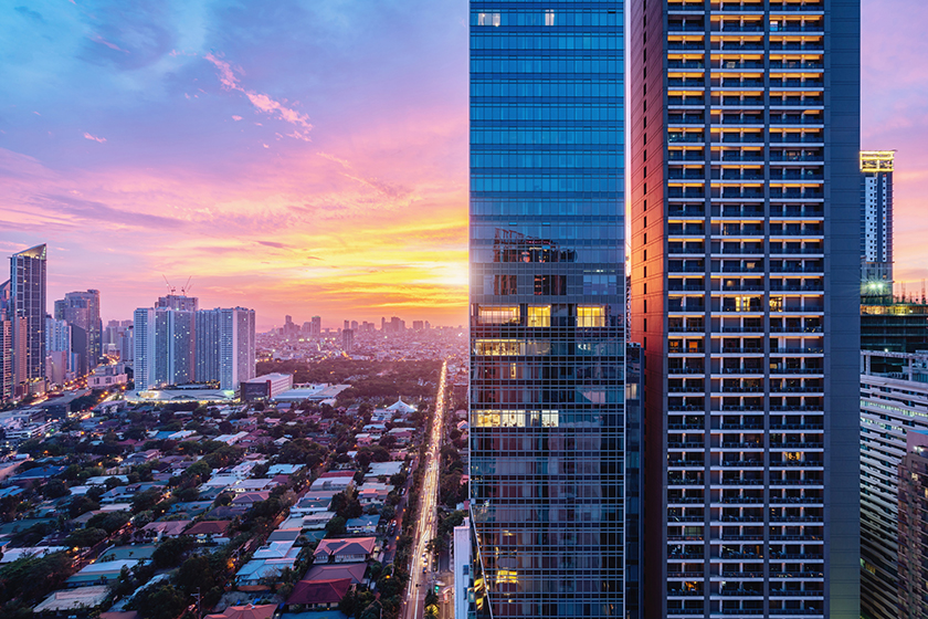 Aerial view, sunset over Makati in downtown Manila, Philippines.